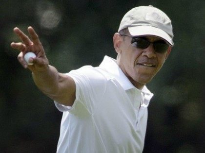 President Barack Obama waves while leaving a green during a round of golf at Farm Neck Golf Club August 15, 2015 in Oak Bluffs, Massachusetts on Martha's Vineyard. Obama golfed with former US President Clinton, Vernon Jordan and Ron Kirk. AFP PHOTO/BRENDAN SMIALOWSKI