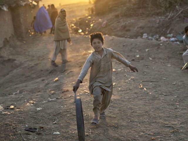 Afghan Boy Playing APMuhammed Muheisen