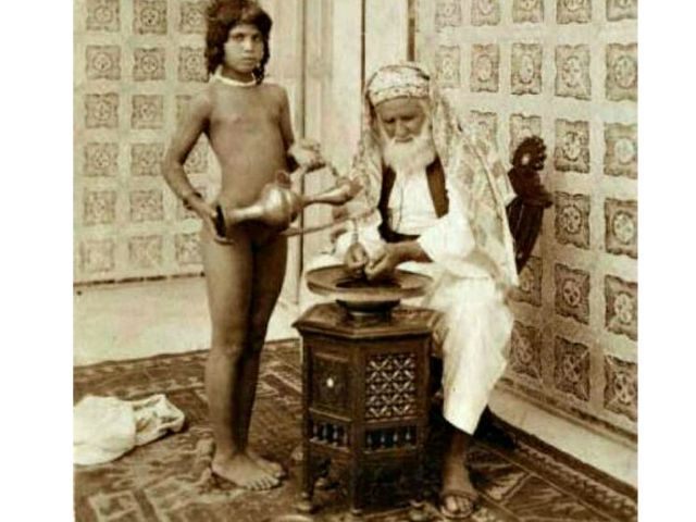 Arab sheikh with servant, 1910. Eugene Chatelain Wiki Commons