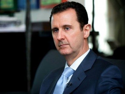 A handout picture released by the Syrian Arab News Agency (SANA) on January 15, 2015 shows Syrian President Bashar al-Assad giving an interview to the Eterarna Novina Czech newspaper in Damascus. Coalition strikes against the Islamic State group are having no impact, Assad said in an interview, as members of …