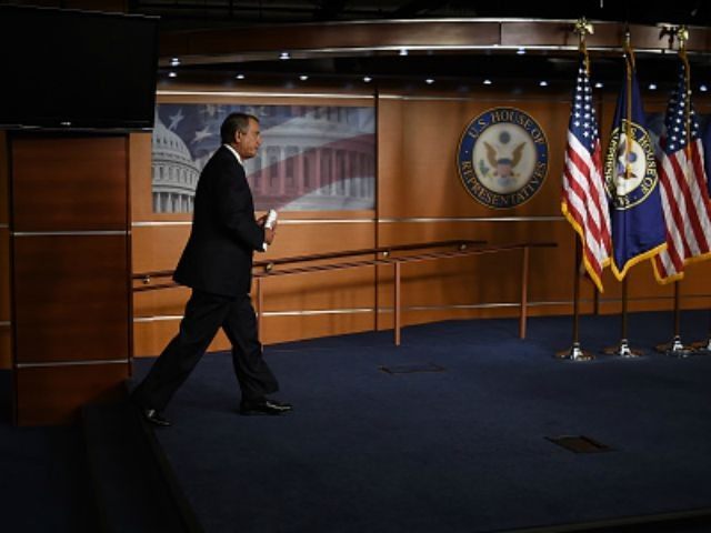 House Speaker John Boehner arrives for his weekly news conference on Capitol Hill on July
