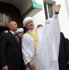 Russia's Prime Minister Vladimir Putin listens to the leader of all Muslims in Russia Ravil Gaynutdin during their meeting in a mosque in Moscow on September 9, 2010.