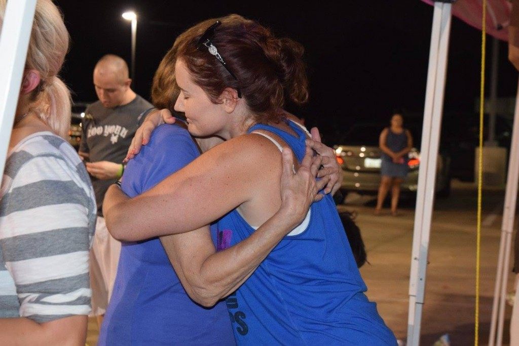 Volunteers hug while acknowledging their success had keeping the vigil for Deputy Goforth alive and raising hundreds of thousands of dollars for his family. (Photo: Breitbart Texas/Bob Price)