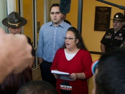 Rowan County clerk Kim Davis gives a statement about her intentions on applying her signature to same sex marriage licenses on her first day back to work, after being released from jail last week, at the Rowan County Courthouse September 14, 2015 in Morehead, Kentucky. Davis was jailed for disobeying …