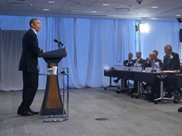 Barack Obama speaks to members of the Business Roundtable at their headquarters in Washington, DC on September 16, 2015. AFP PHOTO/MANDEL NGAN (Photo credit should read