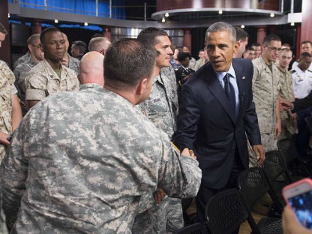 Barack Obama greets troops after holding a 'Worldwide Troop Talk,' a town hall w