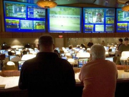 Players watch horse racing at the Race Book at the Borgata Hotel Casino and Spa in Atlantic City, New Jersey, 25 May 2007. The hotel, which opened in 2003 and features 2,000 rooms, touts itself as the first Las Vegas style resort in Atlantic City. Gambling has been legal in …