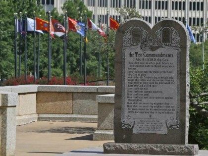 The Ten Commandments monument is pictured at the state Capitol in Oklahoma City, Tuesday, June 30, 2015. Oklahoma's Supreme Court says the monument must be removed because it indirectly benefits the Jewish and Christian faiths in violation of the state constitution.