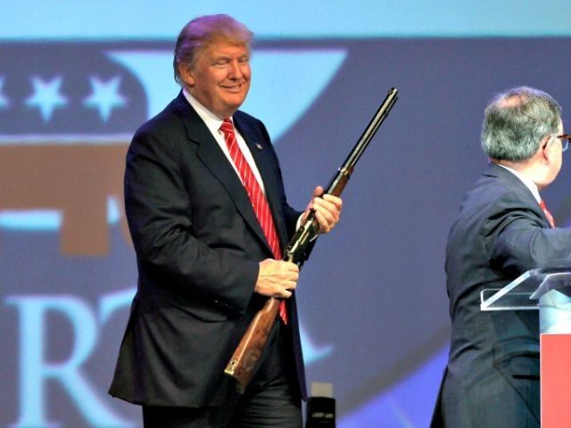 Trump with rifle AP PhotoDanny Johnston