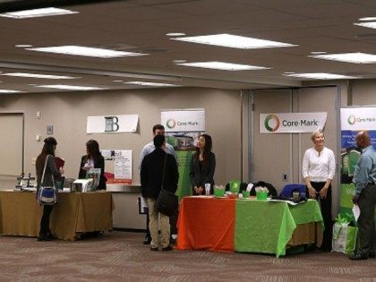 Recruiters wait to meet with job seekers during a HireLive career fair on June 4, 2015 in