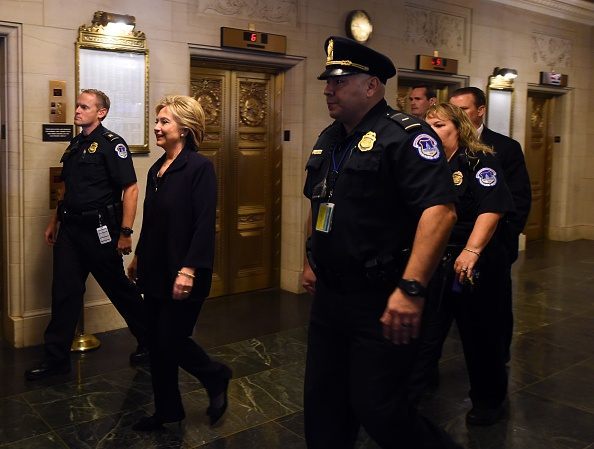 Secretary of State and Democratic Presidential hopeful Hillary Clinton arrives to testify before the House Select Committee on Benghazi on Capitol Hill in Washington, DC, October 22, 2015. AFP PHOTO/JIM WATSON