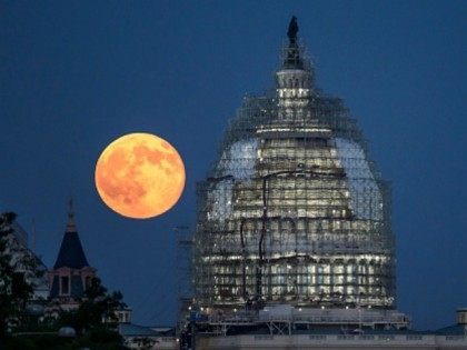 In this handout provided by the National Aeronautics and Space Administration (NASA), a second full moon for the month of July rises behind the dome of the U.S. Capitol on July 31, 2015 in Washington, DC. In recent years, people have been using the name Blue Moon for the second …