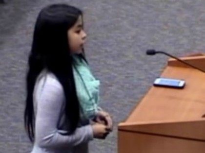 West Memorial Junior High School seventh grade student Jordan Wooley stands alone as she addresses the Katy ISD school board. - Photo