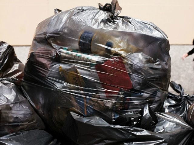 Bags of recycling are piled on a Manhattan street on April 22, 2015 in New York City. Appr