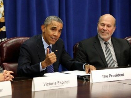 President Barack Obama meets with agriculture and business leaders at the Department of Agriculture October 6, 2015 in Washington, D.C. The President discussed the benefits of the Trans-Pacific Partnership for American businesses and workers. Flanking the president are Victoria Espinel, CEO, The Software Alliance and Bob Stallman, Jr., President, American …