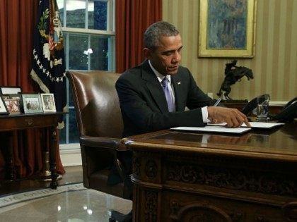U.S. President Barack Obama signs a veto of H.R. 1735 National Defense Authorization Act (NDAA) in the Oval Office October 22, 2015 in Washington, DC. President Obama and Congressional Democrats object to the measure because it uses some $90 billion meant for war spending to avoid automatic budget cuts to …
