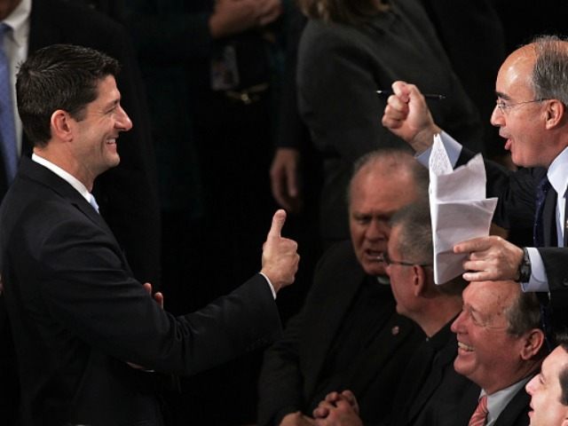 U.S. Rep. Paul Ryan (R-WI) (L) gives a thumbs up to Rep. Bruce Poliquin (R-ME) (R) in the