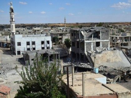 A picture taken on September 30, 2015 shows a general view of deserted streets and damaged buildings in the central Syrian town of Talbisseh in the Homs province.