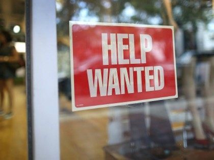 A help wanted sign is seen in the window of the Unika store on September 4, 2015 in Miami, Florida. The U.S. Bureau of Labor Statistics released the August jobs report that shows that the economy created just 173,000 new jobs last month. But the unemployment rate dipped to 5.1%, …