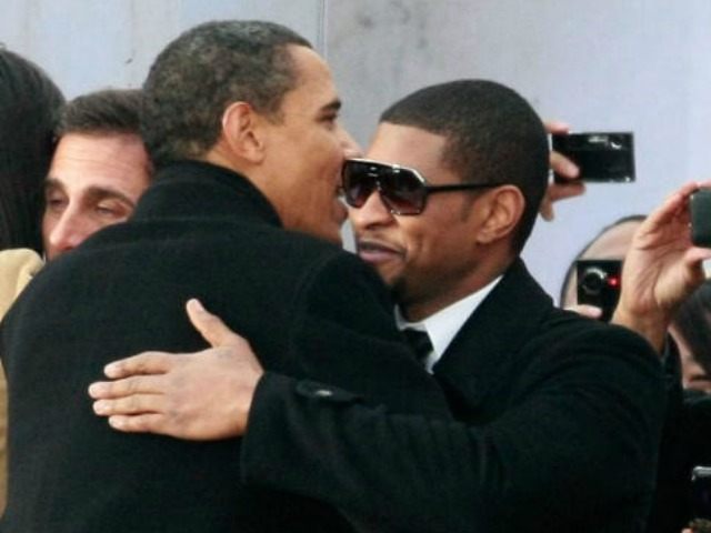 President-elect Barack Obama (L) gets a hug from Usher during the 'We Are One: The Ob
