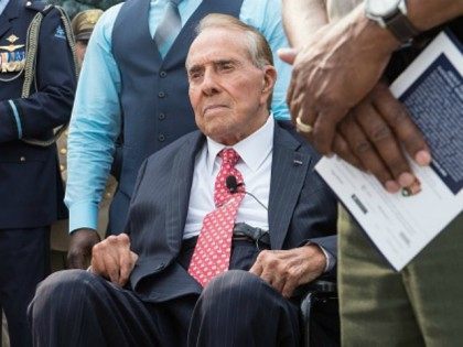 Former US Senator and presidential candidate Bob Dole attends a ceremony marking the 70th anniversary of the Allied Forces victory over Japan in the Pacific at the World War II Memorial in Washington, DC, on September 2, 2015. AFP PHOTO/NICHOLAS KAMM (Photo credit should read