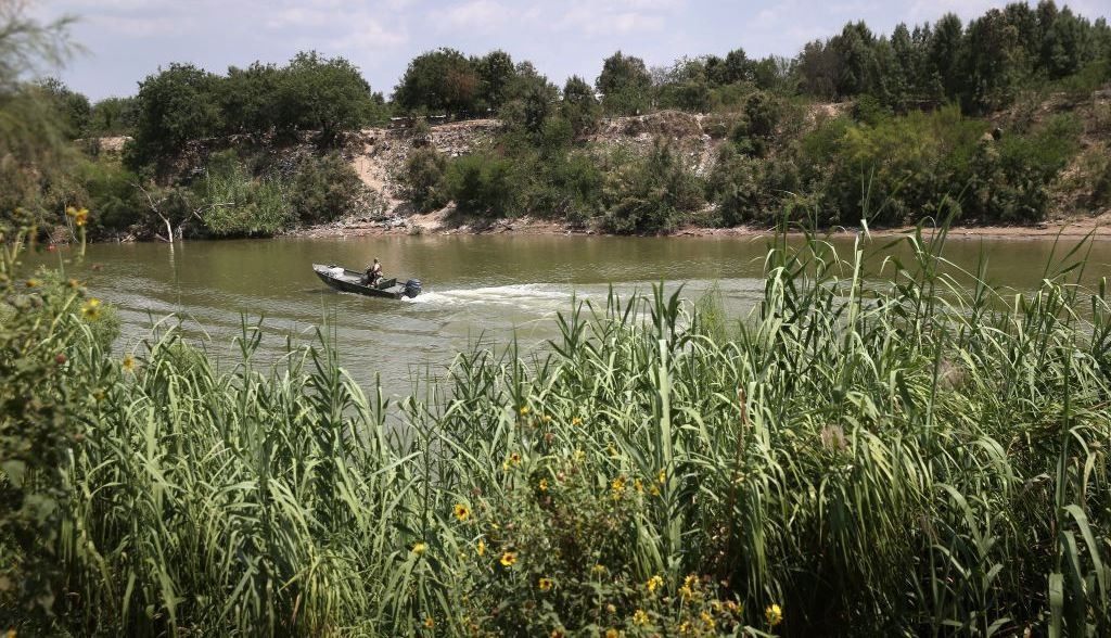 Grassy cane fields along river make for easy hiding for smugglers and their cargo. (Photo: Getty Images/John Moore)