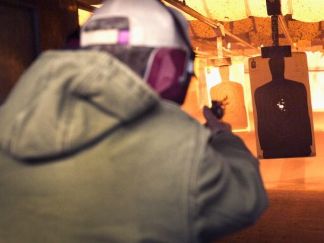 A marksman sights in on a target during a class he was taking to qualify for an Illinois c