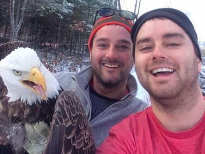 Brothers Pose for Selfie with Eagle