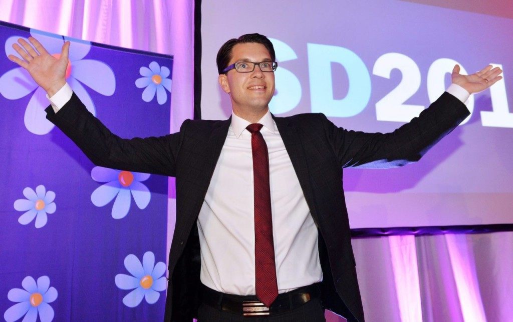 The Sweden Democrats flower on display behind Akeeson