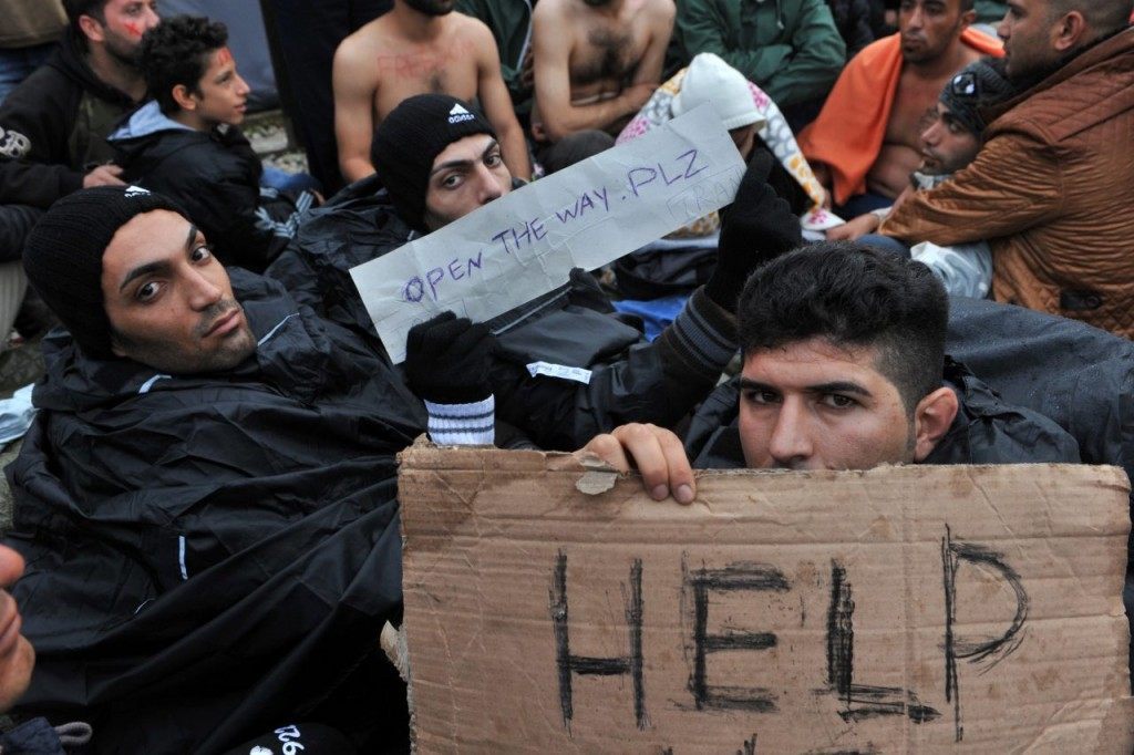 Migrants demonstrate as they wait to cross the Greek-Macedonian border near Idomeni on November 25, 2015. Since last week, Macedonia has restricted passage to northern Europe to only Syrians, Iraqis and Afghans who are considered war refugees. All other nationalities are deemed economic migrants and told to turn back. Over 1,500 people are stuck on the border, mostly Indians, Moroccans, Bangladeshis and Pakistanis. AFP PHOTO /Sakis Mitrolidis / AFP / SAKIS MITROLIDIS (Photo credit should read SAKIS MITROLIDIS/AFP/Getty Images)