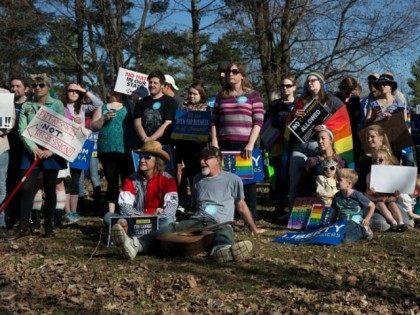 Demonstrators gather at Karst Farm Park on March 31, 2015 in Bloomington, Indiana. Responding to widespread criticism nationally over the state's new controversial Religious Freedom Restoration Act, which critics say can be used to discriminate against gays and lesbians, Indiana Gov. Mike Pence today called on the Republican-controlled general assembly …