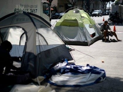 Homeless camp out September 23, 2015, in the skid row section of Los Angeles, California. Mayor Eric Garcetti and City Council members declared public emergency, the first city in the nation to take drastic step in response to increase in homelessness and that they're ready to spend $100 million per …
