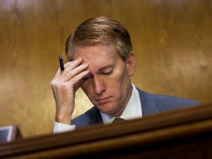 Sen. James Lankford (R-OK) listens to testimony during a Senate Appropriations Financial Services and General Government Subcommittee hearing to review information technology spending and data security at the U.S. Office of Personnel Management, on Capitol Hill, June 23, 2015 in Washington, DC. FBI Director James Comey recently told Senators in …