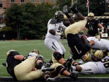 Ralph Webb #7 of the Vanderbilt Commodores dives over the pile for a touchdown against the Missouri Tigers during the first half at Vanderbilt Stadium on October 24, 2015 in Nashville, Tennessee. (Photo by