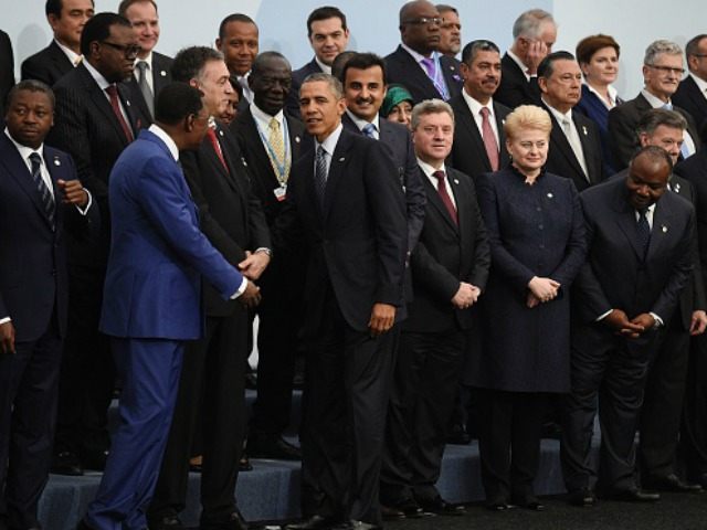 Barack Obama (5thL) is greeted by world leaders as he arrives for the family photo at the COP21, United Nations Climate Change Conference, in Le Bourget, outside Paris, on November 30, 2015. More than 150 world leaders are meeting under heightened security, for the 21st Session of the Conference of …