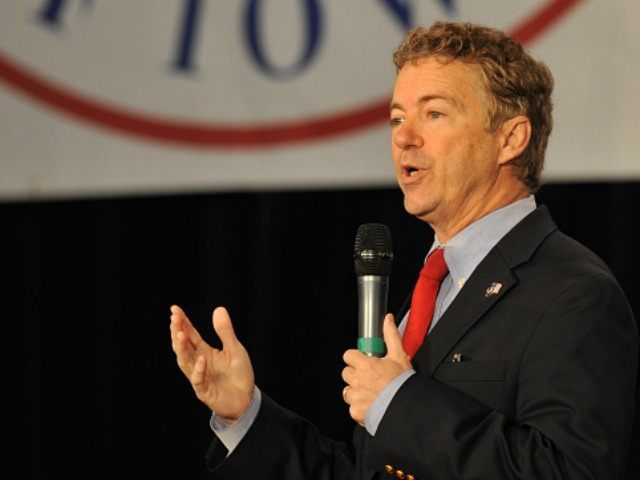 Republican presidential candidate Sen. Rand Paul (R-KY) (L) speaks at the Growth and Oppor