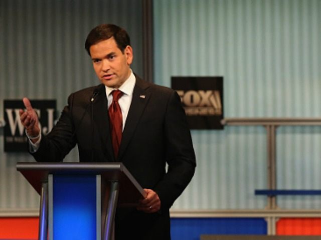 Presidential candidate Republican Sen. Marco Rubio (R-FL) speaks while Donald Trump looks on during the Republican Presidential Debate sponsored by Fox Business and the Wall Street Journal at the Milwaukee Theatre November 10, 2015 in Milwaukee, Wisconsin. The fourth Republican debate is held in two parts, one main debate for …