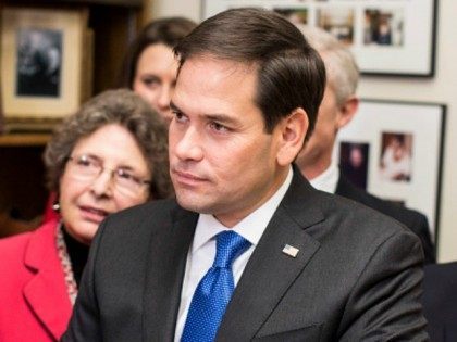 Republican Presidential candidate Marco Rubio (R-FL) listens to New Hampshire Secretary of