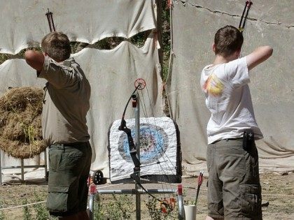 Boy Scout shoot bow and arrows at camp Maple Dell on July 31, 2015 outside Payson, Utah.