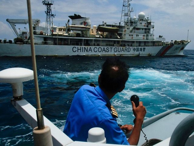 KUANTAN, MALAYSIA - MARCH 15: A member of the Malaysian Navy makes a call as their ship approaches a ship belonging to the Chinese Coast Guard during an exchange of communication in the South China Sea on March 15, 2014 in Kuantan, Malaysia. During a press conference today the Malaysian …