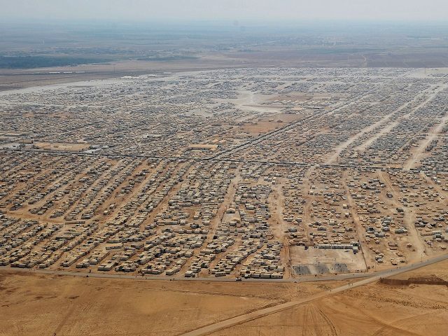 An aerial view shows the Zaatari refugee camp, near the Jordanian city of Mafraq July 18, 2013. U.S. Secretary of State John Kerry spent about 40 minutes with half a dozen refugees who vented their frustration at the international community's failure to end Syria's more than two-year-old civil war, while visiting the camp that holds roughly 115,000 Syrian refugees in Jordan about 12 km (eight miles) from the Syrian border. REUTERS/Mandel Ngan/Pool 