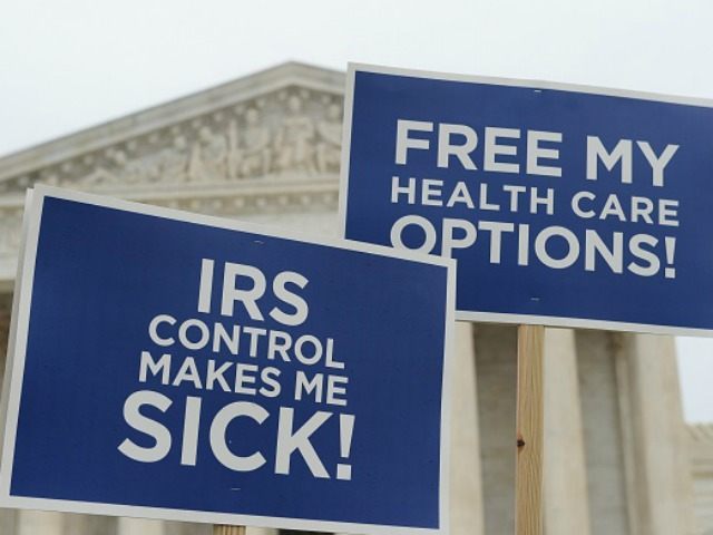 Protestors hold placards challenging 'Obamacare' outside of the US Supreme Court