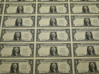 A sheet of freshly printed one dollar bills is ready for inspection at the Bureau of Engraving and Printing on March 24, 2015 in Washington, DC. The roots of The Bureau of Engraving and Printing can be traced back to 1862, when a single room was used in the basement …