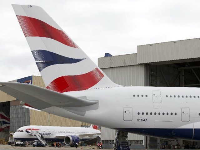 A tail of a British Airways plane is pictured at …