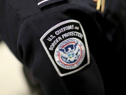 A U.S. Customs and Border Protection officer's patch is seen as they unveil a new mobile app for international travelers arriving at Miami International Airport on March 4, 2015 in Miami, Florida. Miami-Dade Aviation Department and U.S. Customs and Border Protection (CBP) unveiled a new mobile app for expedited passport …