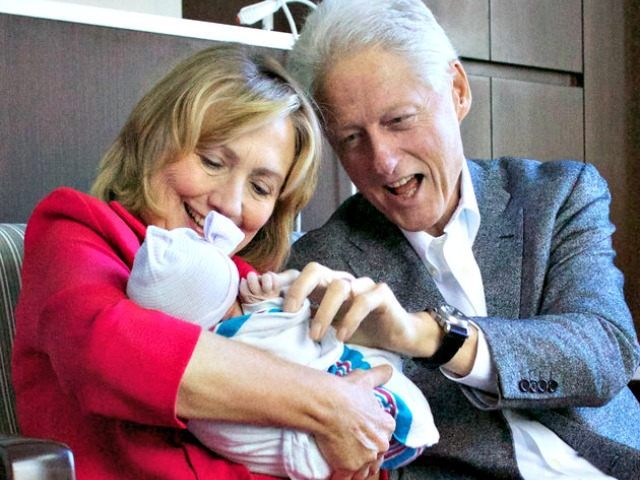 Clintons and grandchild JON DAVIDSONAP
