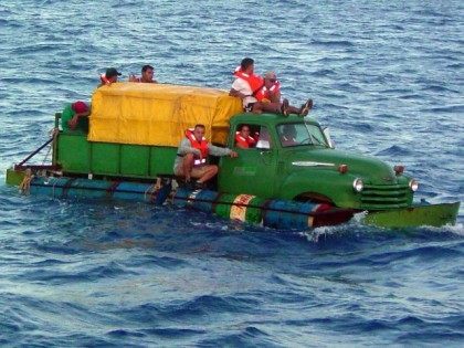 Cuban migrants trying to reach the U.S. coast in Florida ride in a makeshift boat made out of a 1951 Chevrolet truck, converted into a marine vessel with air-filled drums for flotation and a propeller driven off the driveshaft. The photograph was shot on July 16, 2003 but released a …
