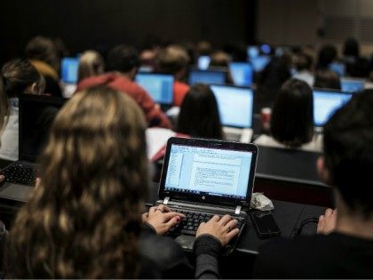 Students of the Catholic University of Lyon use laptops to take notes in a classroom, on S