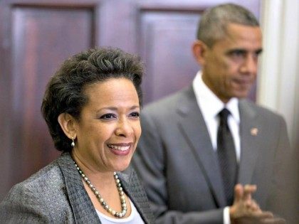 Lynch and Obama Carolyn Kaster AP