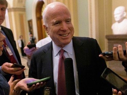 : Senate Armed Services Committee Chairman John McCain (R-AZ) (C) talks with reporters aft